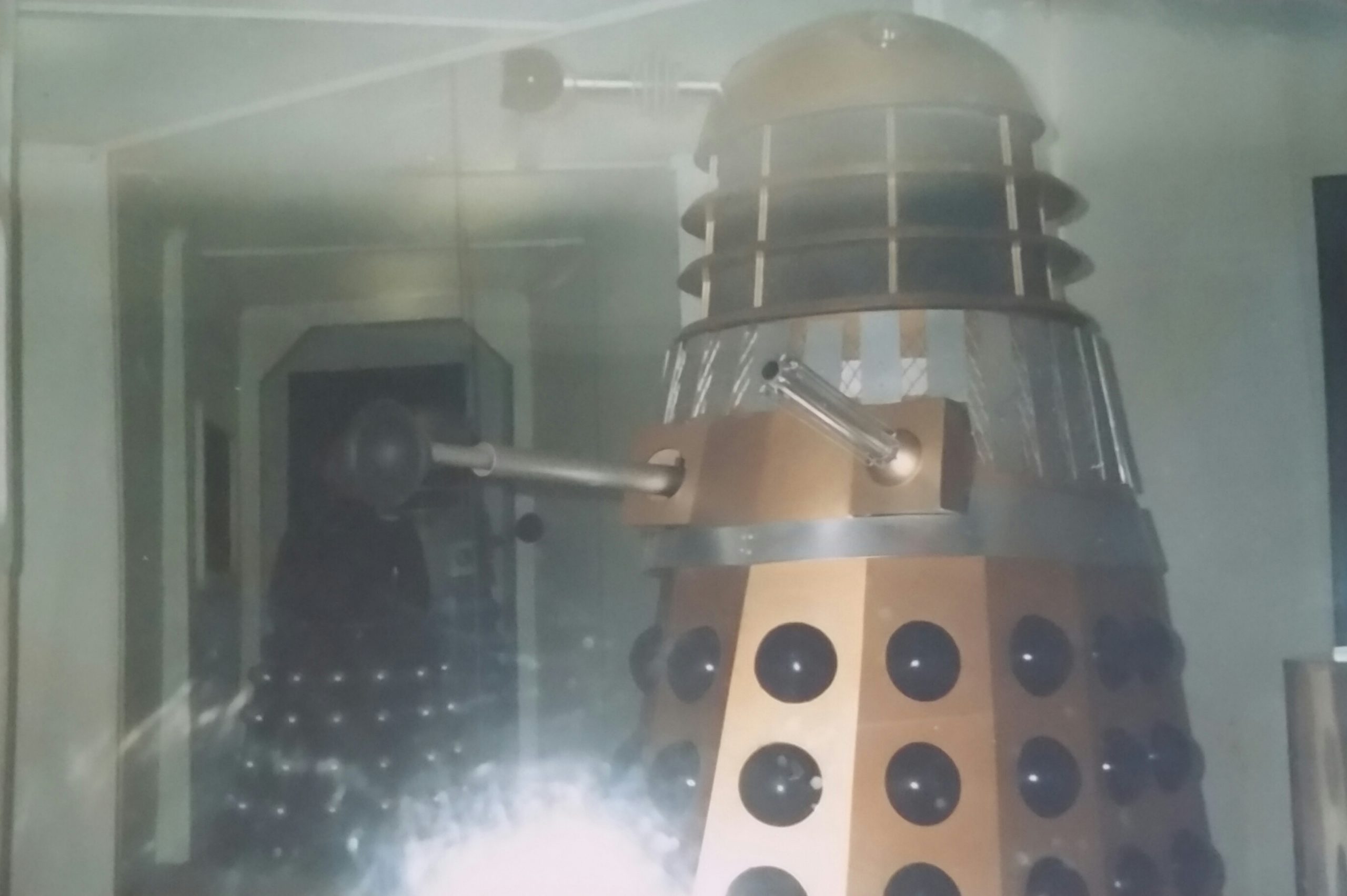 A gold Dalek with Davros in the back looking ominous. - Longleat exhibition 1989. Image Copyright - Dave Armitage.